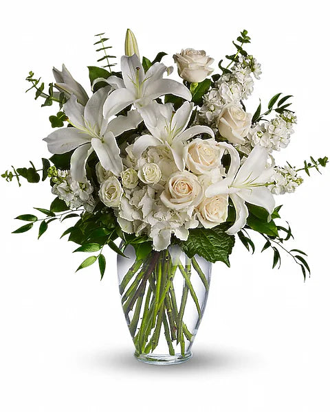 Bouquet of white flowers in a clear vase