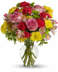 Bouquet of colorful flowers in a clear vase 